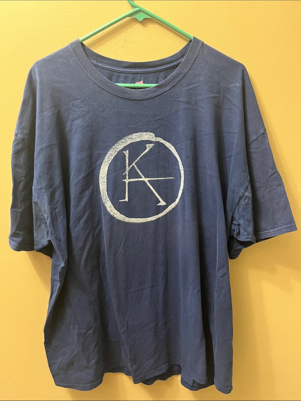 KA is a Wheel Hanes Navy Short-Sleeve Tee with White Circle KA Logo
